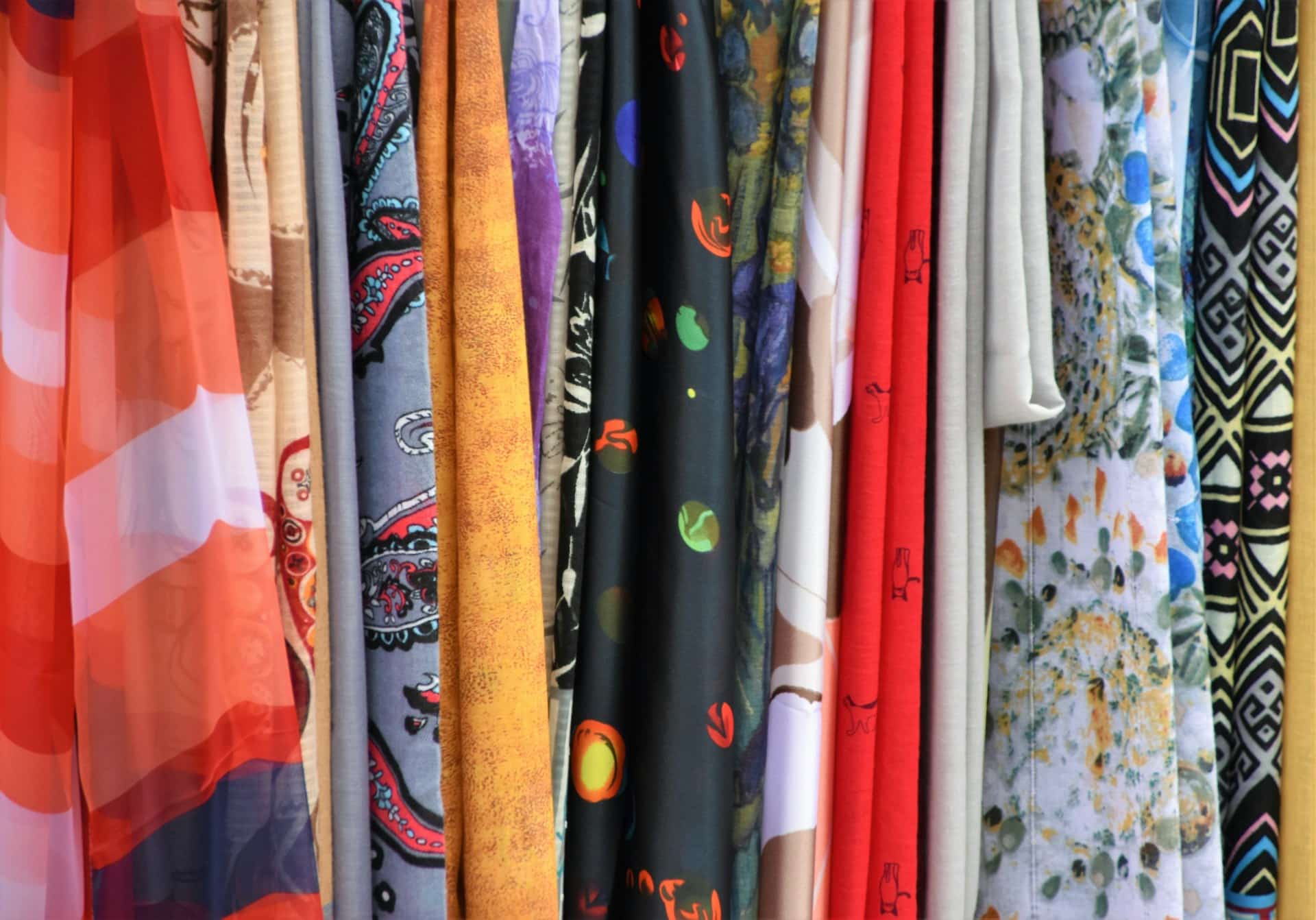 Fabrics on a clothing rack