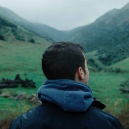Man looking at mountains