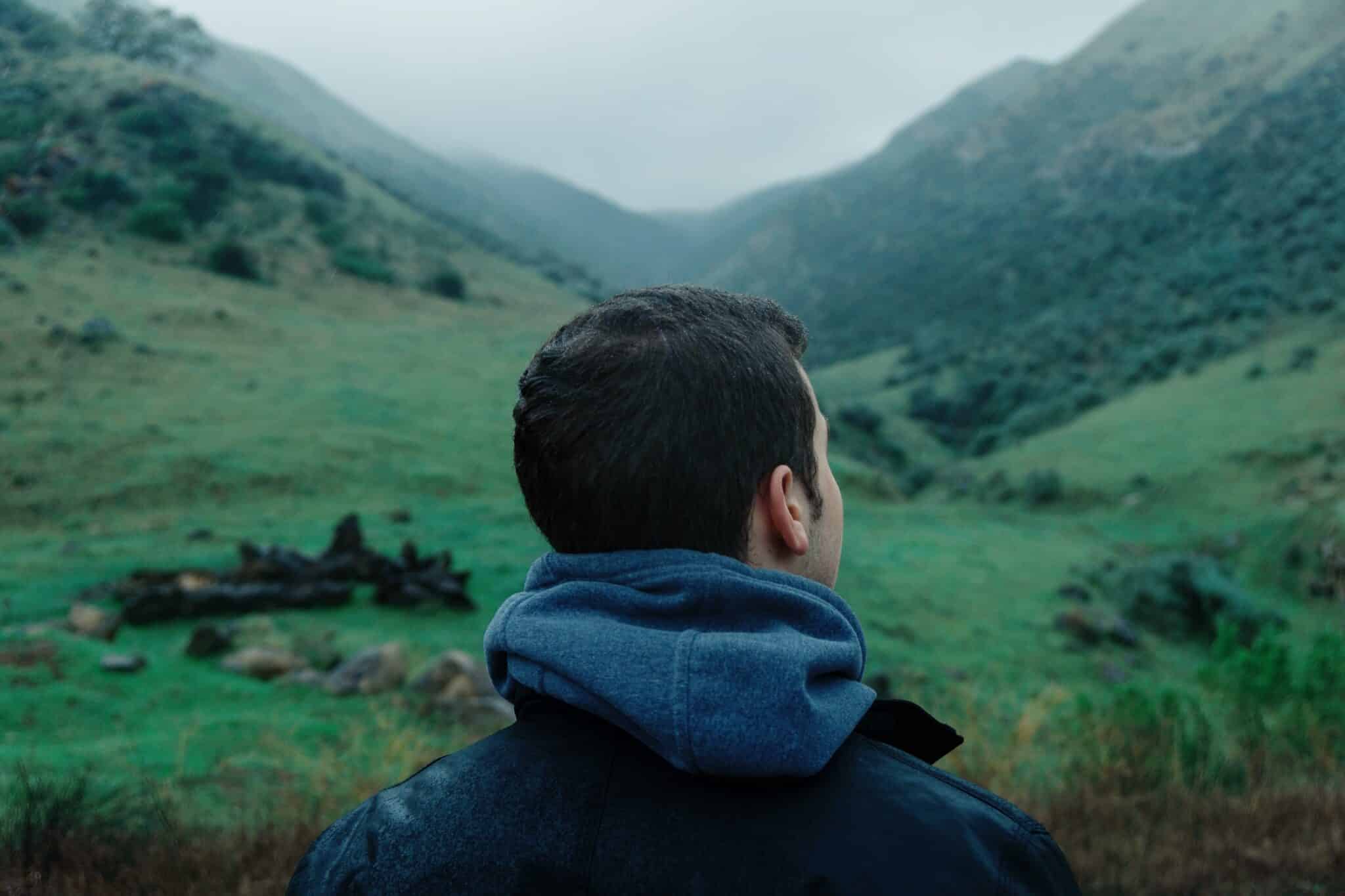 Man looking at mountains