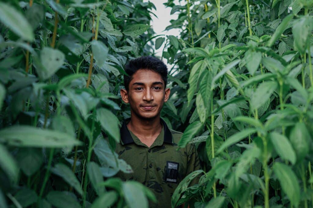 Young man among trees