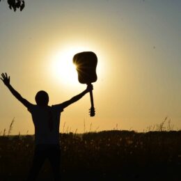 man holding guitar