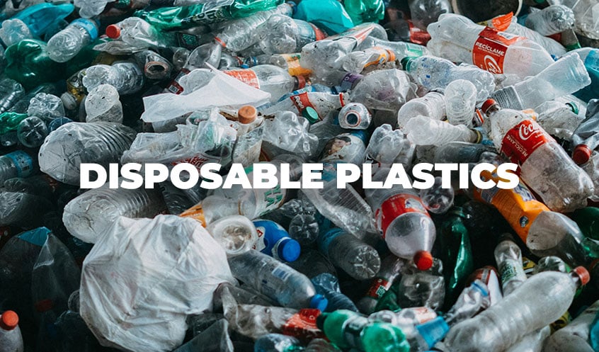disposal plastics text with plastic trash pile in background
