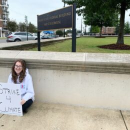 isabel holds climate strike sign