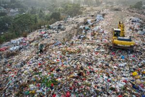 Drone shot of landfill with excavator