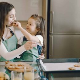 people eating cookies in kitchen