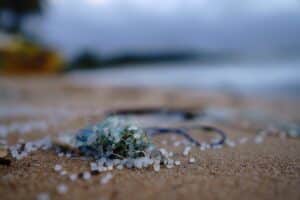 Green and brown pebbles on beach