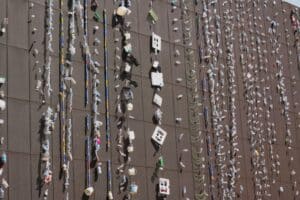 photo, art installation in turkey, with waste hanging off the side of a building Photo by Zeynep S. on Unsplash