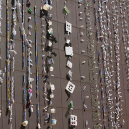 photo, art installation in turkey, with waste hanging off the side of a building Photo by Zeynep S. on Unsplash