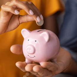 People holding piggy bank.